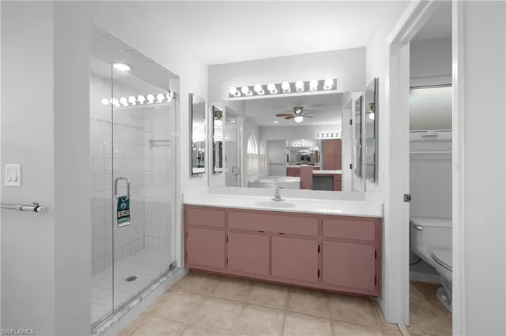 Dual sinks , walk in shower. and separate toilet room
