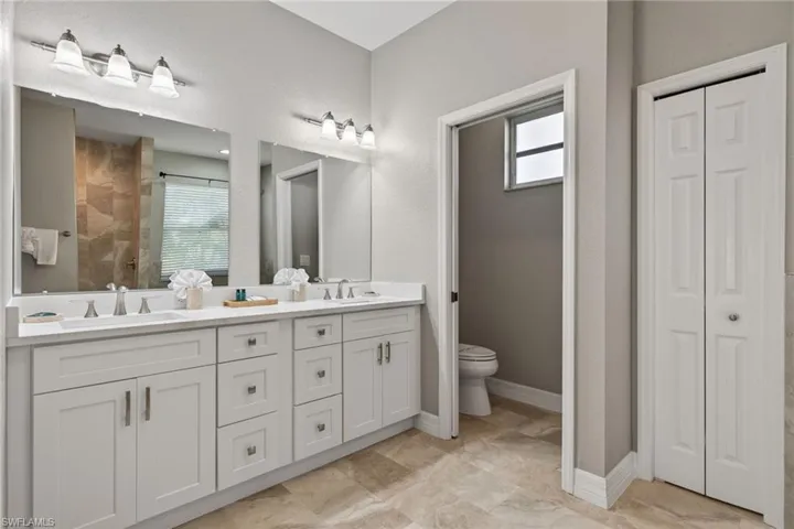 Brand New remodeled Full bathroom featuring a closet and double vanity