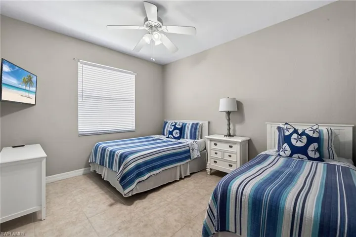Bedroom featuring ceiling fan and light tile patterned floors