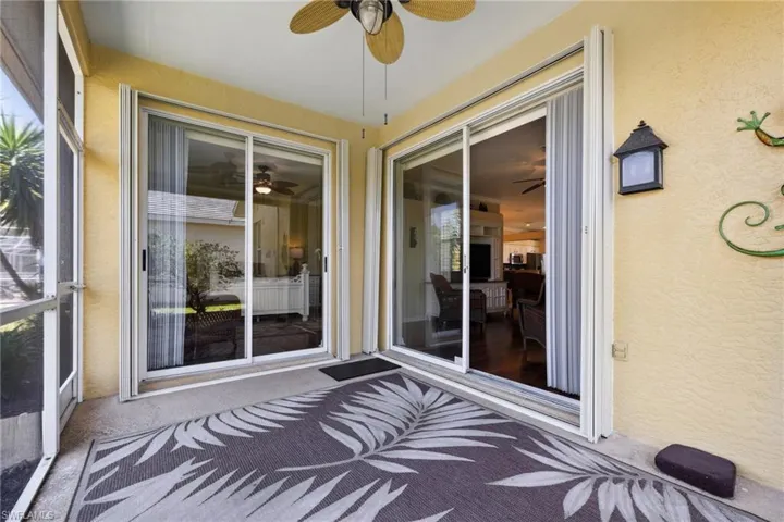 Unfurnished sunroom with a ceiling fan