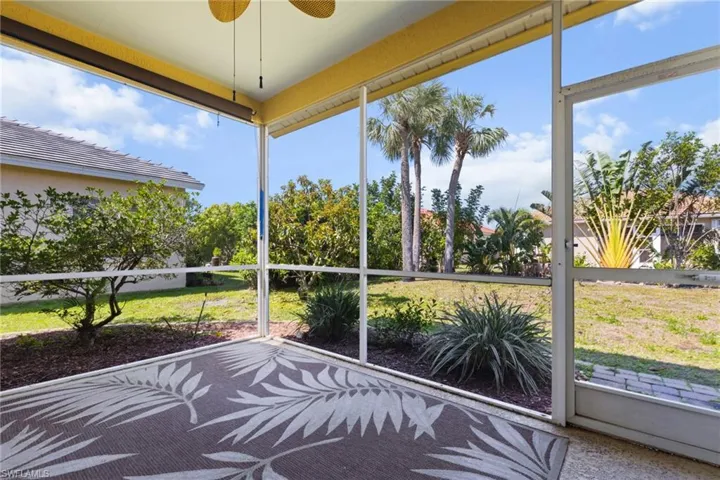Unfurnished sunroom with a wealth of natural light and a ceiling fan