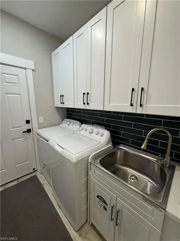 Laundry room featuring cabinet space and washing machine and dryer