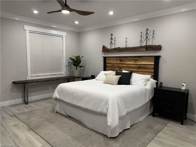 Bedroom featuring ornamental molding, recessed lighting, ceiling fan, and light wood-style floors