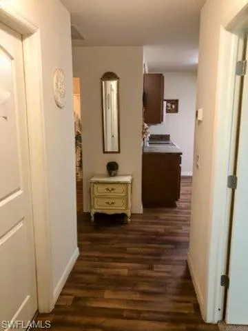 Hall featuring dark hardwood / wood-style flooring