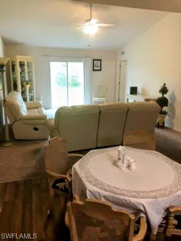Dining space featuring ceiling fan and hardwood / wood-style floors