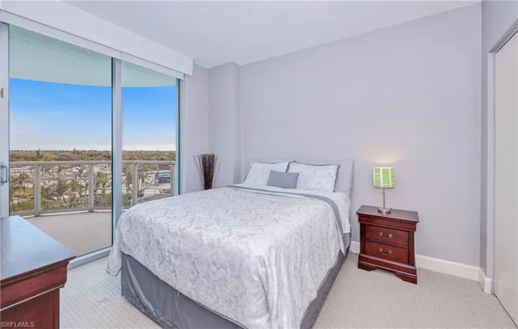 Carpeted bedroom featuring access to exterior