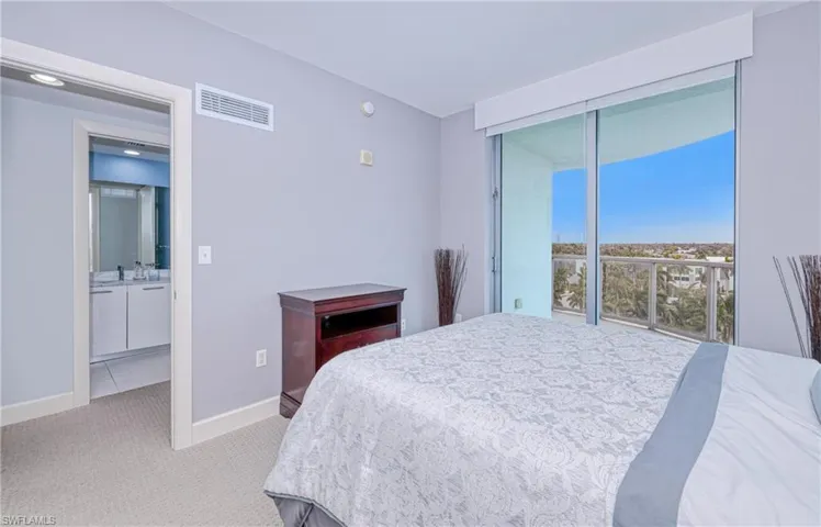 Carpeted bedroom featuring sink