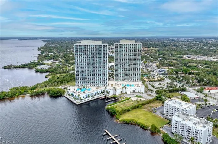 Birds eye view of property featuring a water view