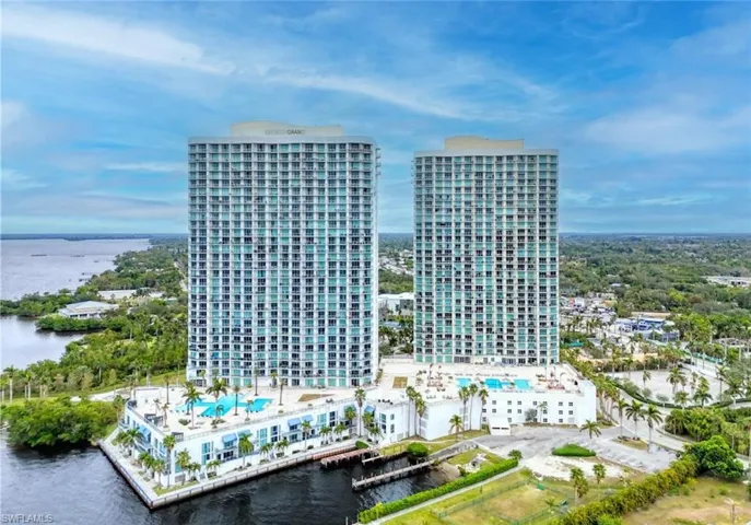 Birds eye view of property with a water view