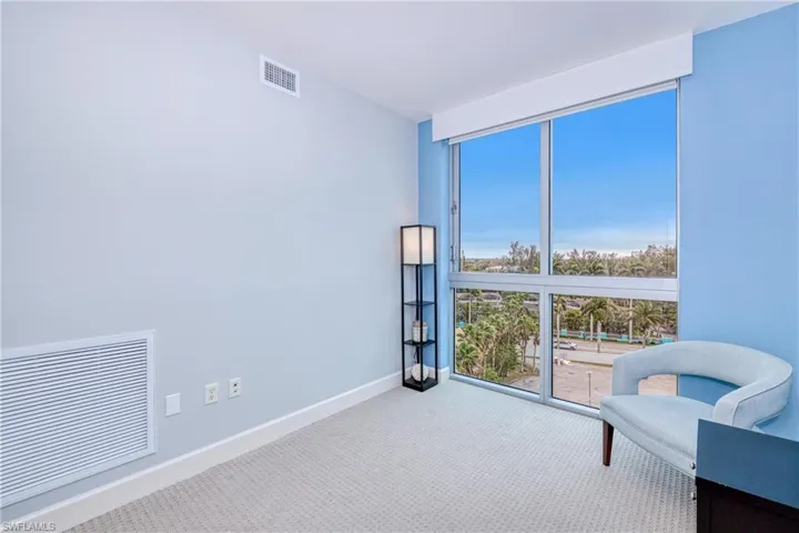 Den room featuring light colored carpet