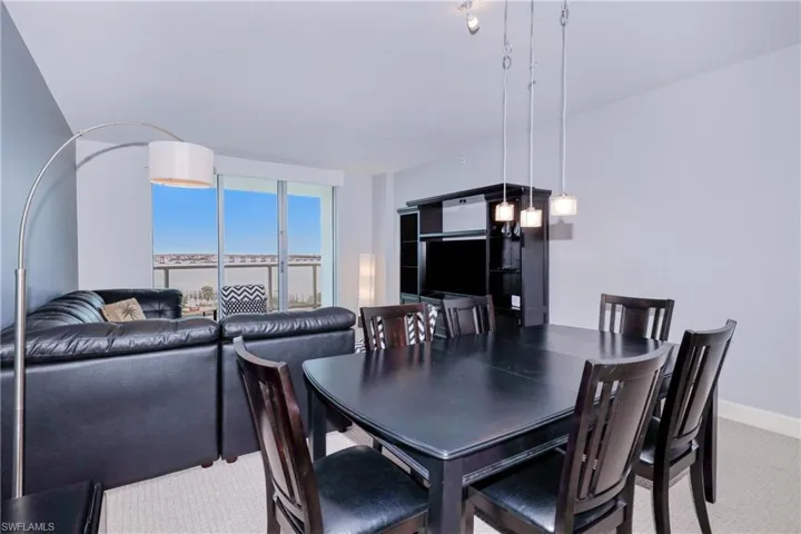 Dining space with light colored carpet