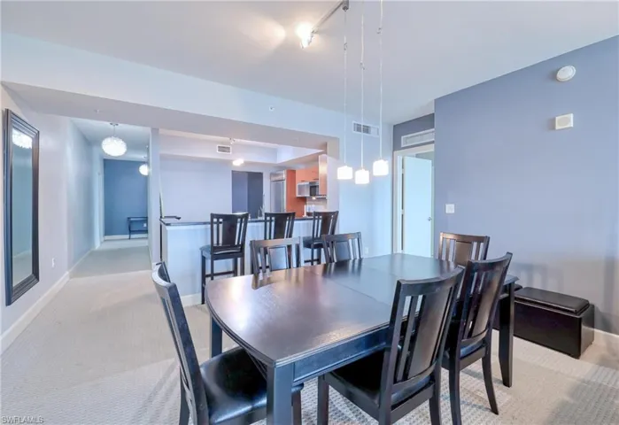 Dining room featuring light colored carpet