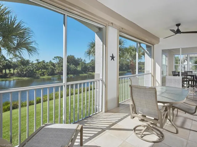 Sunroom featuring a water view