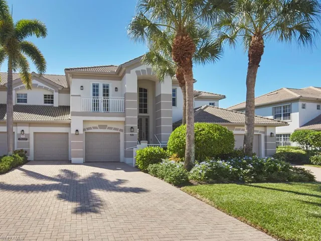 Mediterranean / spanish-style home featuring a balcony, stucco siding, decorative driveway, a garage, and a tile roof