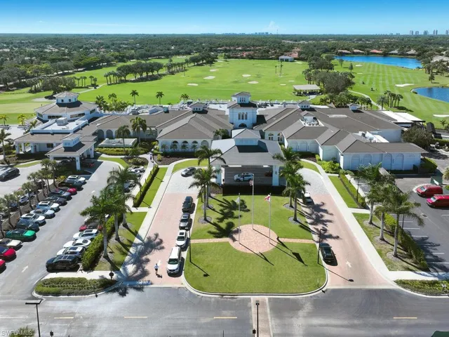 Drone / aerial view of a large body of water and a local golf course