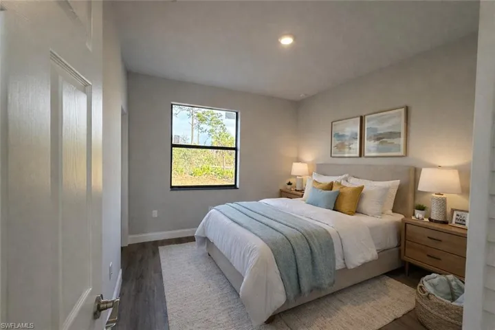 Bedroom featuring wood finished floors and recessed lighting