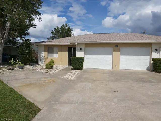 Ranch-style home featuring stucco siding, concrete driveway, a shingled roof, and a garage