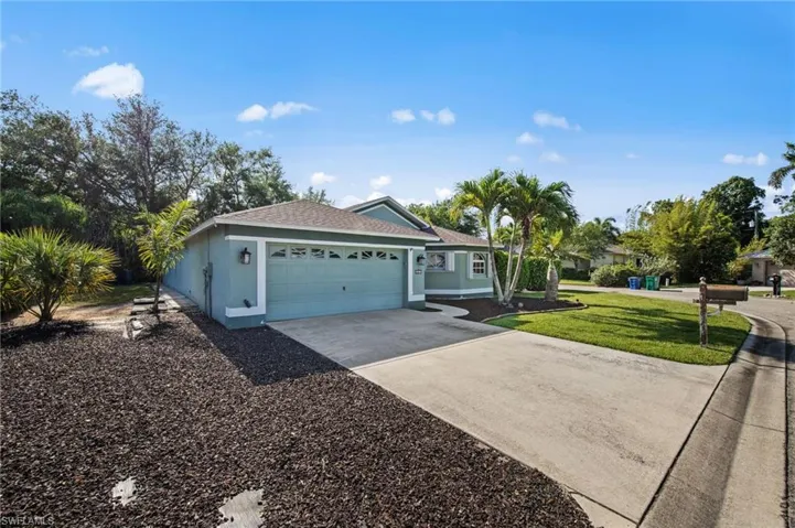 Single-story residence featuring a two-car garage, a concrete driveway, and a shingle roof
