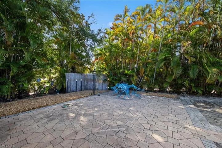 Paved patio area featuring irregular-shaped pavers and a gravel border