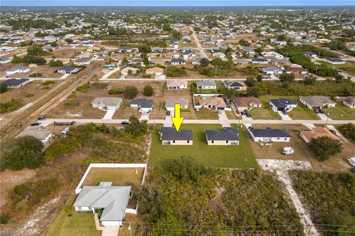View of property location with nearby suburban area