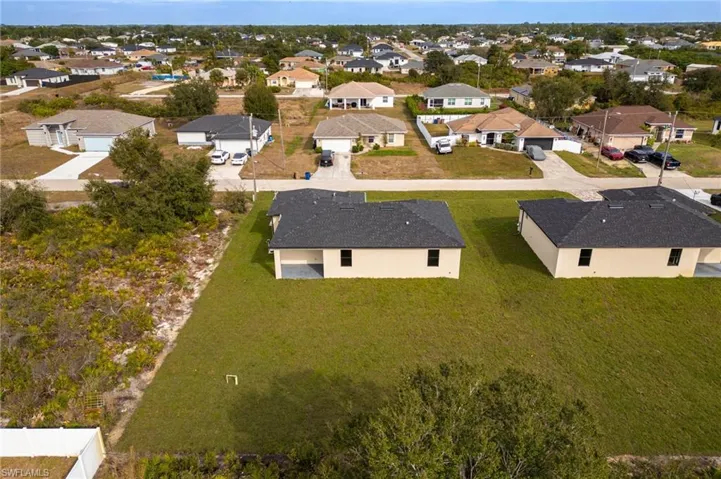 Aerial overview of property's location featuring nearby suburban area