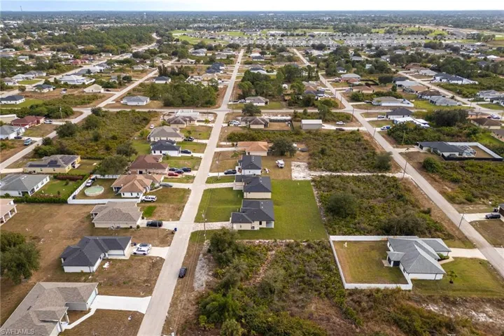 Aerial overview of property's location with nearby suburban area