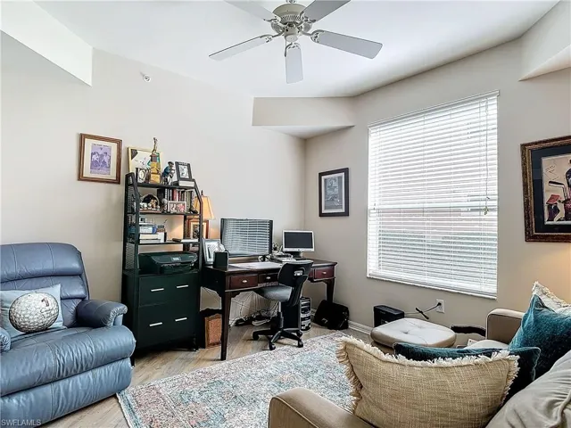 Office space featuring light hardwood / wood-style floors and ceiling fan