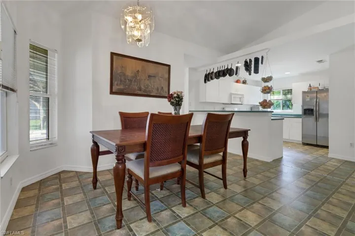 Dining room featuring a notable chandelier and plenty of natural light