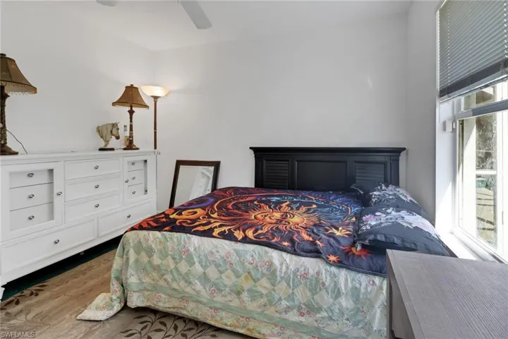 Bedroom with wood-type flooring and ceiling fan