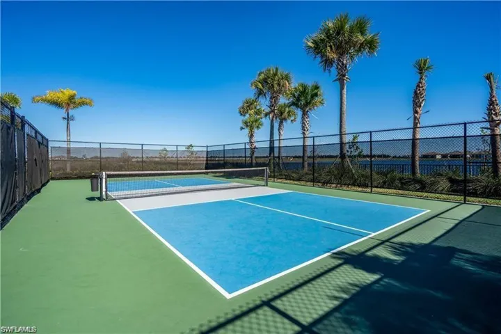 View of tennis court featuring community basketball court