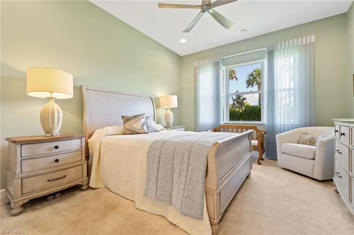 Primary bedroom features custom drapery
