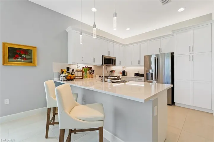 Kitchen features breakfast bar built in pantry