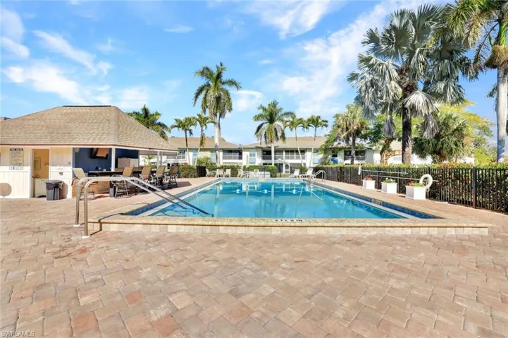 Community pool with a patio area
