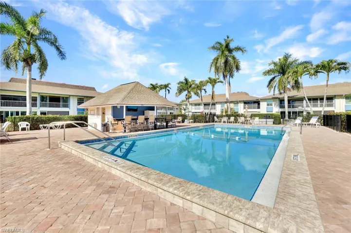 Community pool with a patio area