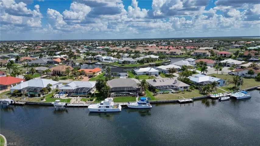 Aerial perspective of suburban area with a large body of water