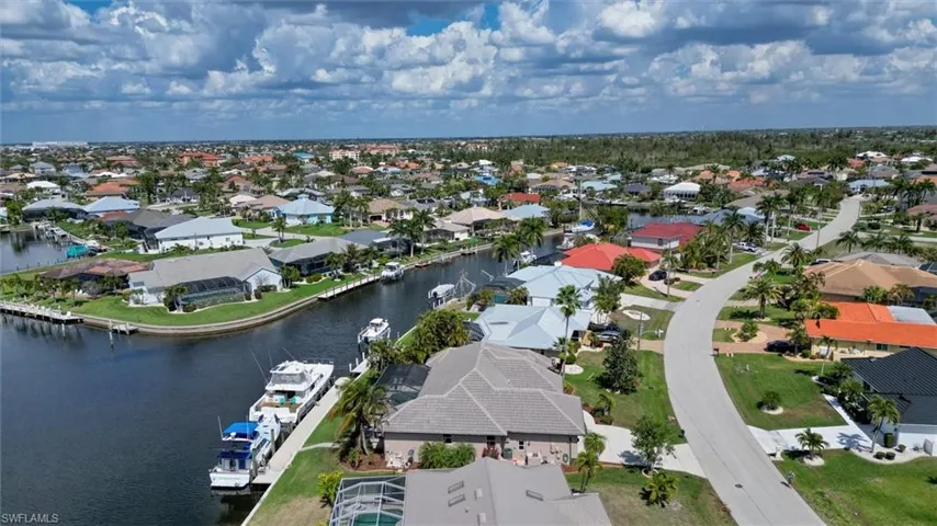 Aerial view of residential area with a large body of water