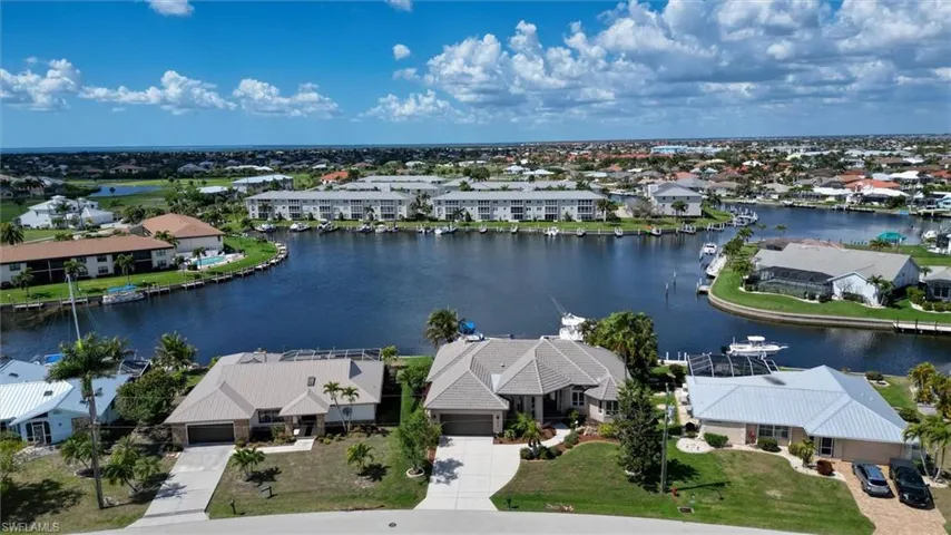 Aerial view of residential area with a nearby body of water