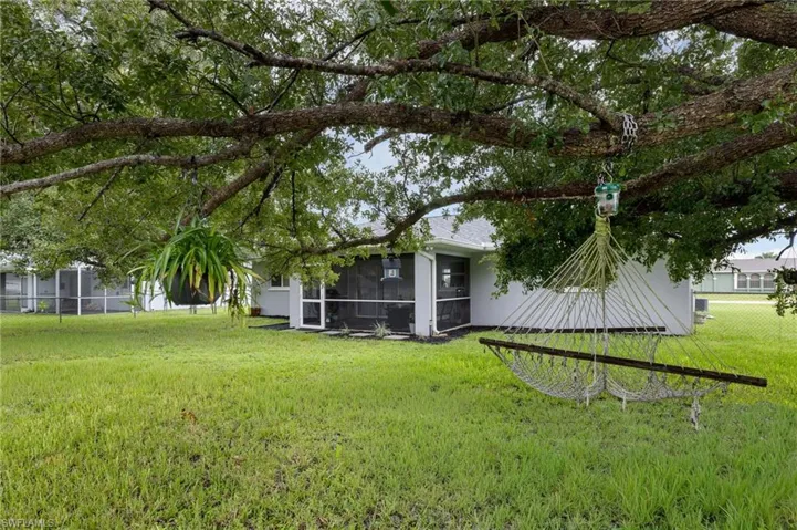 View of yard with a sunroom