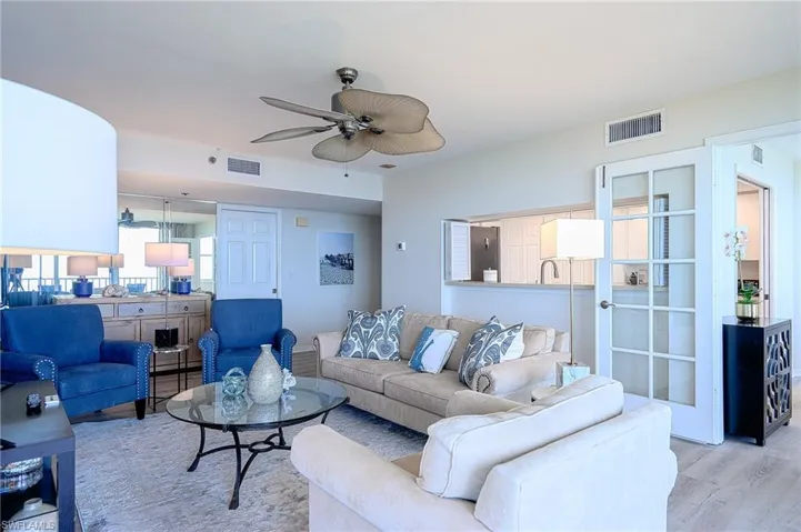 Living room featuring ceiling fan and light hardwood / wood-style floors