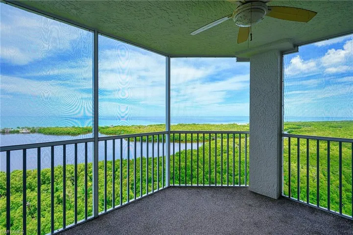 Screened lanai with Gulf views and a ceiling fan for added comfort