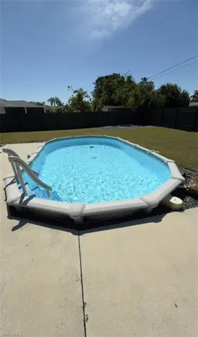 View of pool featuring a fenced backyard