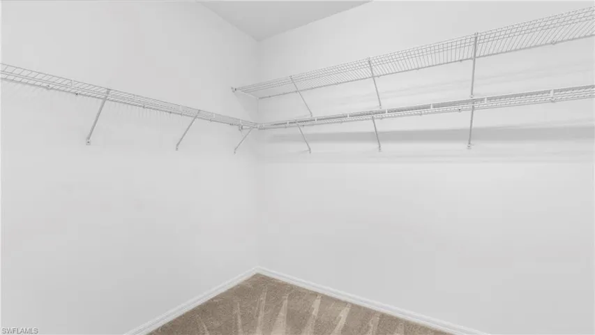 Walk-in closet in primary bedroom
