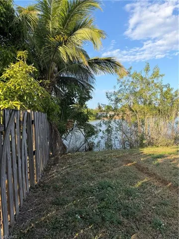 View of yard with a water view