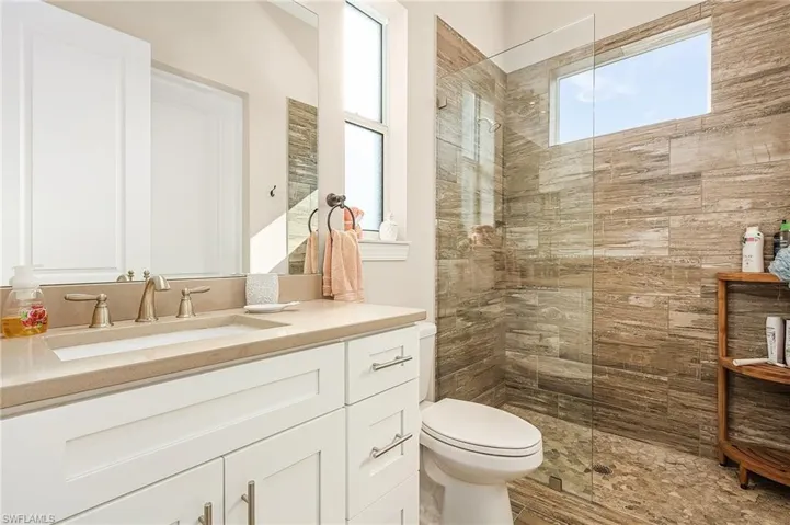 Bedroom 2 En-suite Bath with Tile Shower & Leads to Pool