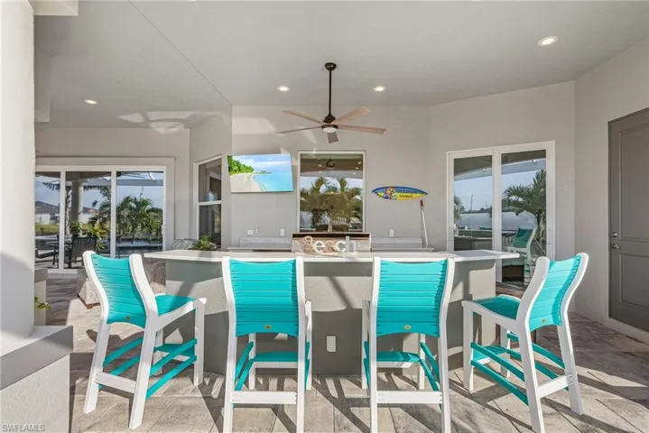 Outside Island Bar, Built-in Grill, Sink, Granite Countertop, tv