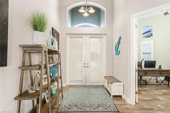 Foyer with tall ceilings throughout home