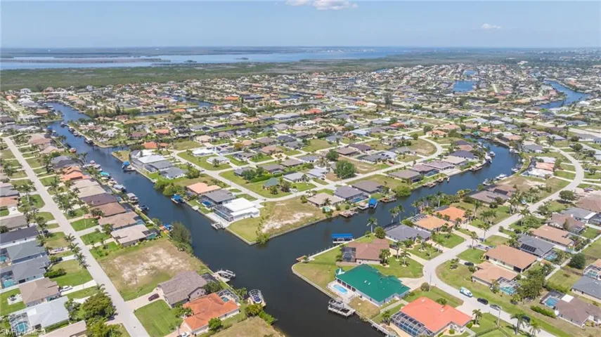 Drone / aerial view featuring a residential view and a water view