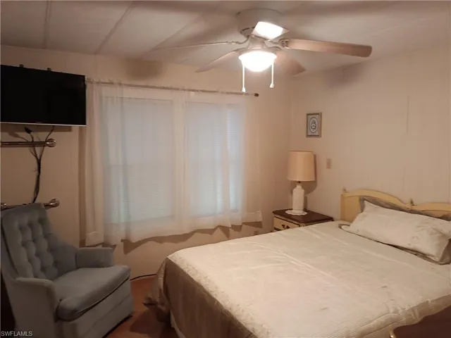 GUEST Bedroom with TV and  ceiling fan