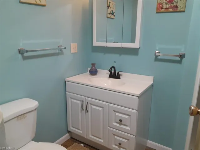 Bathroom with toilet and vanity