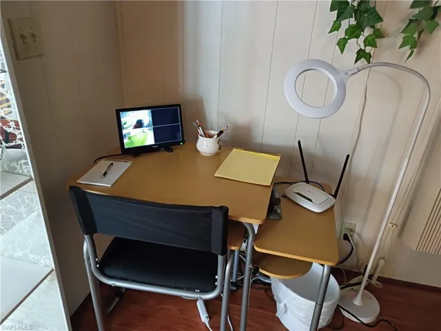 Office area with wood-type flooring
